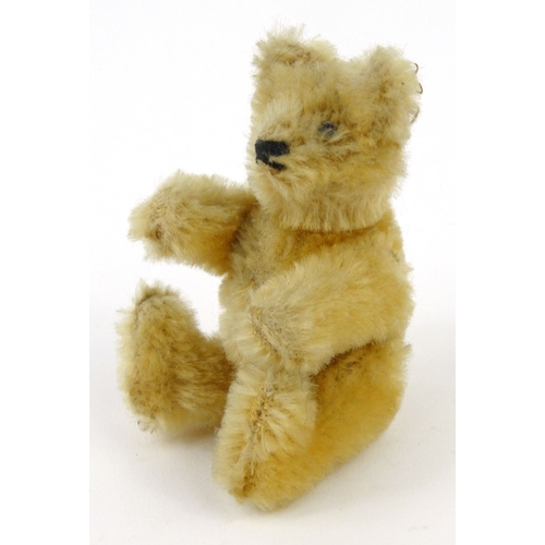 539 - Miniature straw filled teddy bear with beaded glass eyes, 19cm high