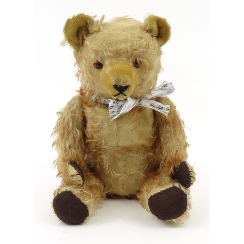 536 - Old straw filled teddy bear with beaded glass eyes, 42cm high