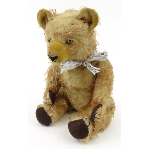 536 - Old straw filled teddy bear with beaded glass eyes, 42cm high