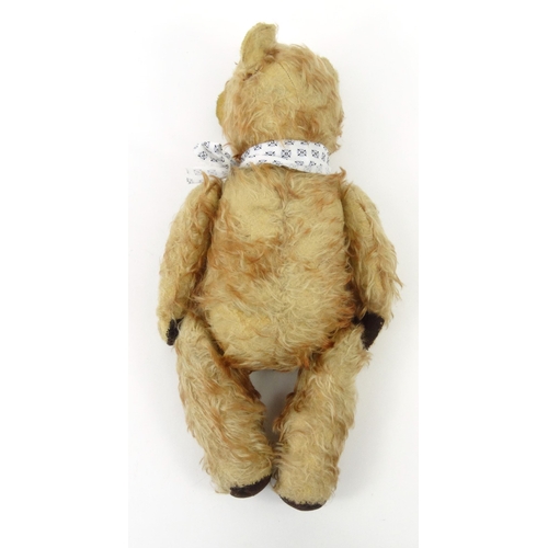 536 - Old straw filled teddy bear with beaded glass eyes, 42cm high