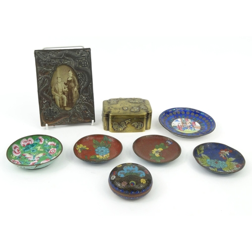 582 - Oriental Chinese cloisonné dishes, circular box and cover, antimony dragon photo frame and a brass b... 