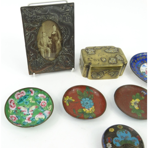 582 - Oriental Chinese cloisonné dishes, circular box and cover, antimony dragon photo frame and a brass b... 