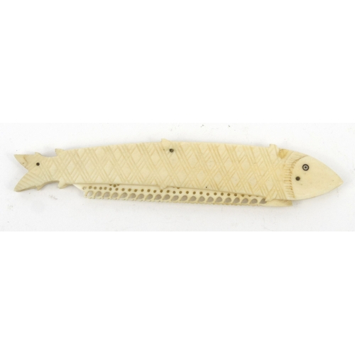 37 - Carved bone fish design folding penknife, 14cm diameter