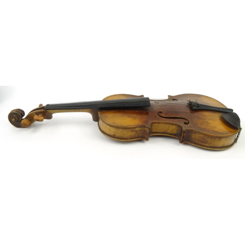 286 - Old cased wooden violin, together with a bow, the back 37cm long