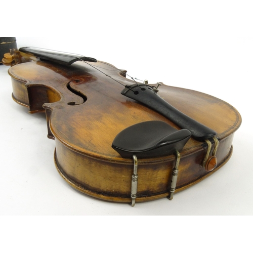 286 - Old cased wooden violin, together with a bow, the back 37cm long