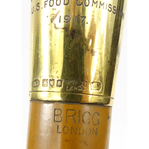 443 - Military interest Brigg of London gilt silver topped walking stick presented by the US Food Commissi... 
