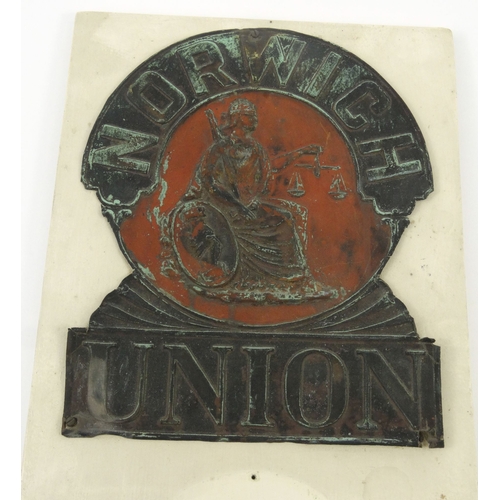 49 - Tin Norwich Union Insurance fire plaque mounted on a wooden board, 27cm x 22cm
