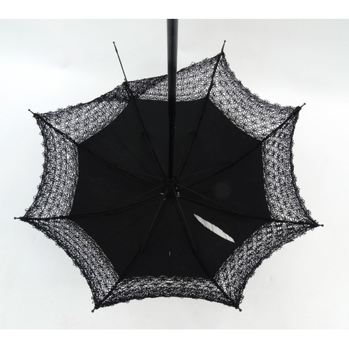 144 - Vintage lady's black silk parasol, 103cm long