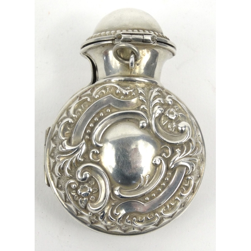 90 - Embossed silver cased glass scent bottle, hallmarked Birmingham 1901-02, 7cm high