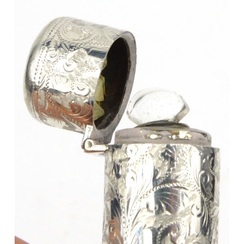 93 - Silver cased scent bottle with floral chased decoration and glass liner, H&T Birmingham 1893-94, 6.5... 