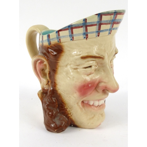 736 - French Sarreguemines pottery face jug, impressed 3210 to base, 20cm high