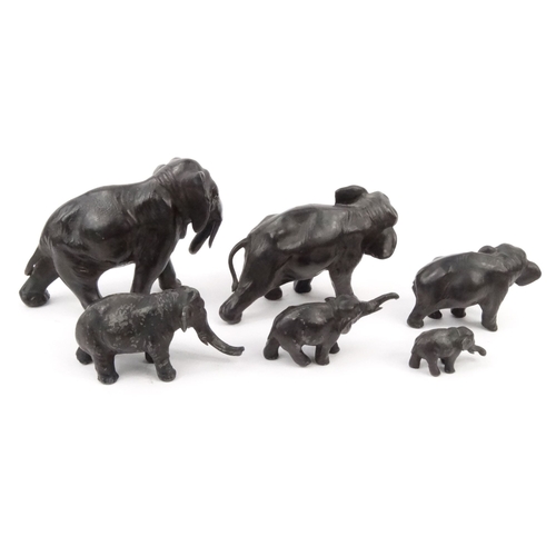 577 - Group of oriental cast metal elephants, some with character marks to the base, the largest 16cm diam... 