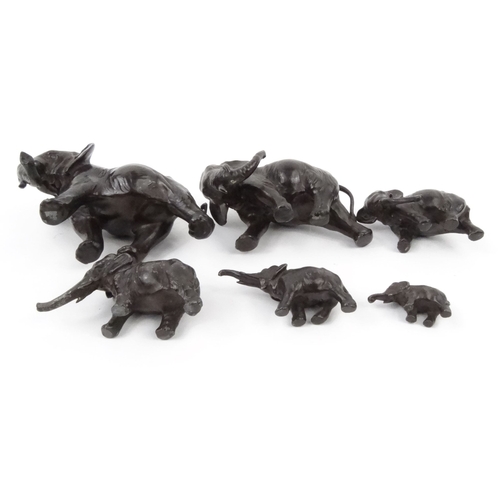 577 - Group of oriental cast metal elephants, some with character marks to the base, the largest 16cm diam... 