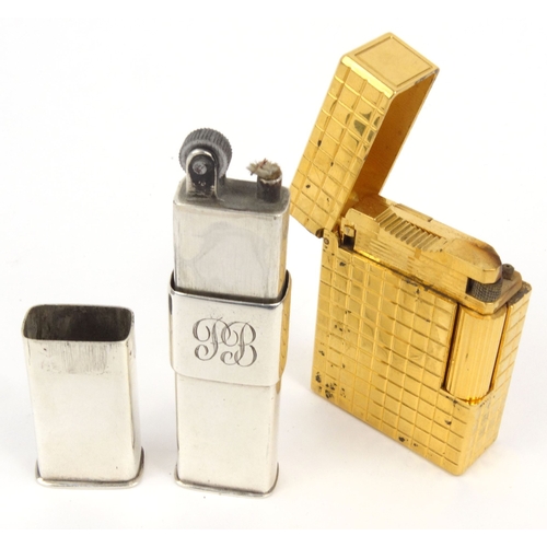 122 - Three lighters comprising boxed Dunhill bark design lighter, silver coloured example and a Dupont ex... 