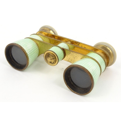 43 - Pair of green guilloche enamel mother of pearl opera glasses marked Busch Multinett D.R.G.M in a lea... 