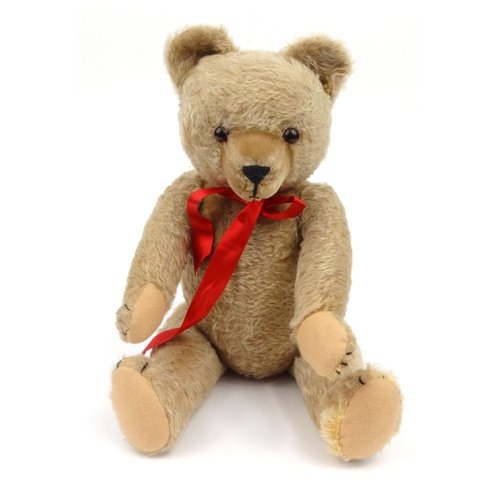 535 - Vintage Hermann straw filled teddy bear with jointed limbs and glass eyes, 50cm high