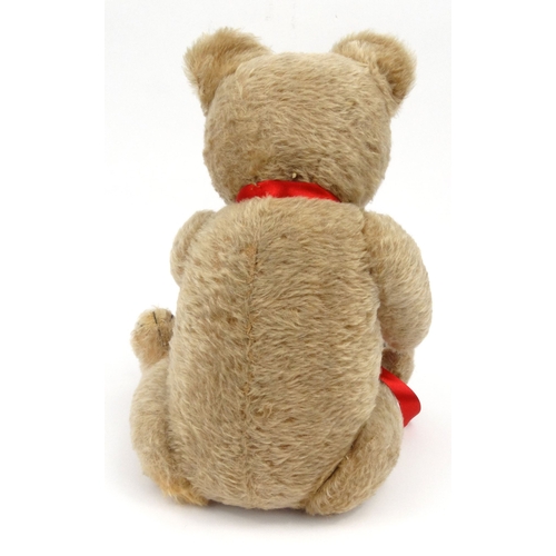 535 - Vintage Hermann straw filled teddy bear with jointed limbs and glass eyes, 50cm high