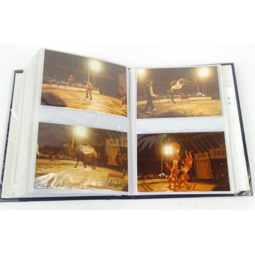 527 - Album of vintage black and white and coloured photographs taken from circuses including views of ele... 