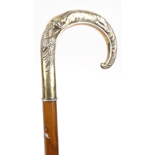 142 - Wooden walking stick with dog design silver handle, hallmarked Birmingham 1987, 88cm long