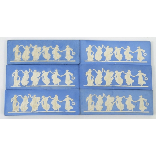 716 - Six Wedgwood style blue and white Jasperware plaques with panels of dancing maidens, each 19cm diame... 