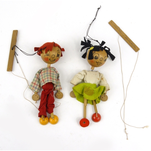 563 - Two wooden Pelham puppets, each 23cm high