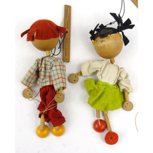 563 - Two wooden Pelham puppets, each 23cm high