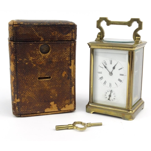 1304 - Victorian brass carriage clock striking on a gong, with original leather carrying case, 12cm high ex... 