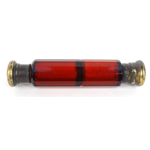 213 - Victorian ruby glass double scent bottle with gilt metal caps, 14.5cm long