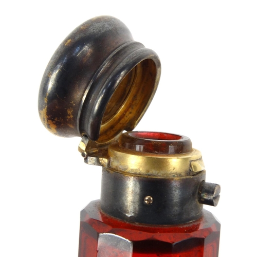 213 - Victorian ruby glass double scent bottle with gilt metal caps, 14.5cm long