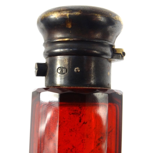 213 - Victorian ruby glass double scent bottle with gilt metal caps, 14.5cm long