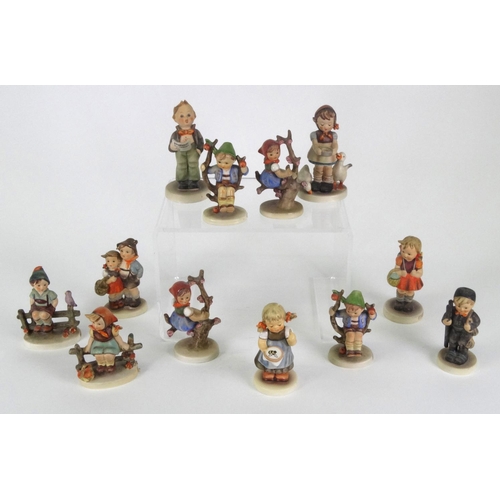 121 - Group of 12 hand painted Goebel Hummel figures including Appletree Boy, Schoolgirl, Wayside Harmony,... 
