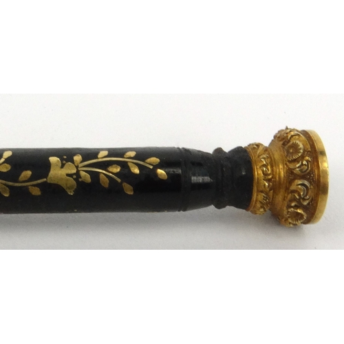 97 - Victorian tortoiseshell dip pen with gilt metal floral inlay and citrine end, 15.5cm long