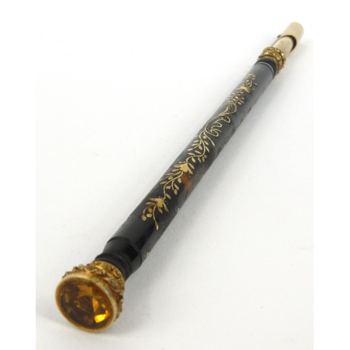 97 - Victorian tortoiseshell dip pen with gilt metal floral inlay and citrine end, 15.5cm long