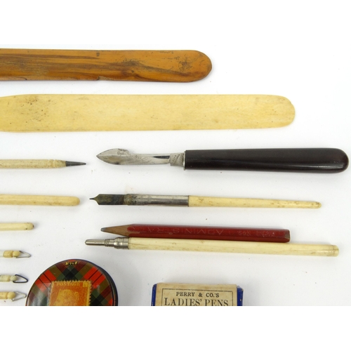 107 - Tartan ware stamp box, selection of bone handled dip pens, ivory letter opener, wooden handled scalp... 