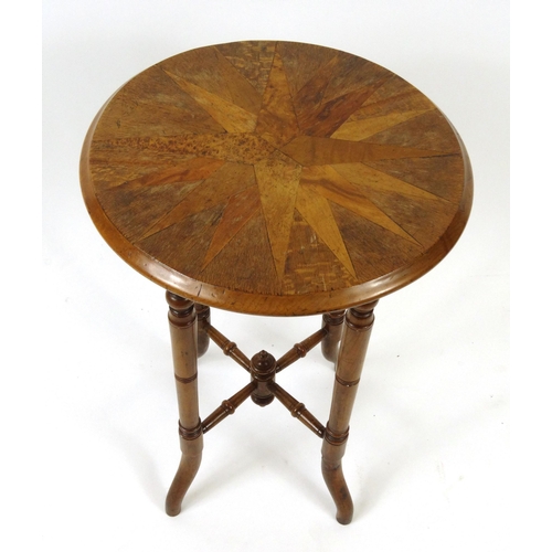 32 - Circular specimen occasional table, the star top inlaid with exotic woods, 66cm high x 44cm diameter