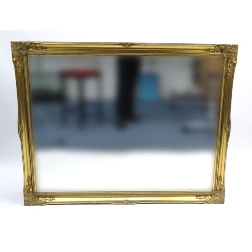 41 - Large ornate gilt frame bevel edged wall mirror, approximately 132cm x 104cm