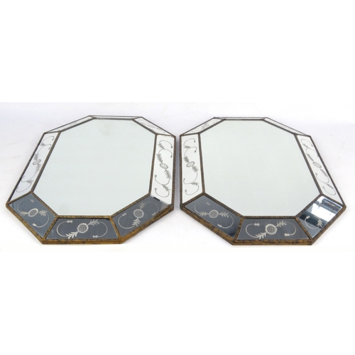 28 - Pair of continental glass mirrors with circular leaf decoration, each 77cm x 50cm