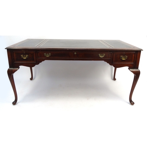 23 - Mahogany partner's desk with tooled leather top, fitted with three drawers, 67cm high x 157cm wide x... 
