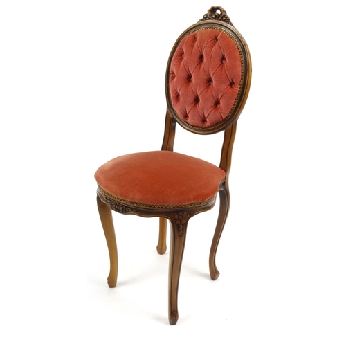 57 - Carved walnut occasional chair with pink buttonback upholstery