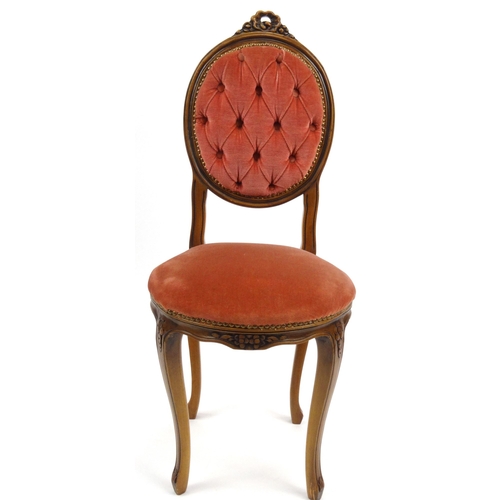 57 - Carved walnut occasional chair with pink buttonback upholstery