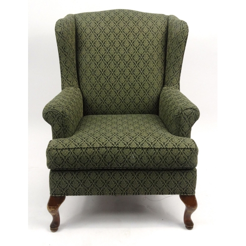 40 - Green floral wingback armchair, 98cm high