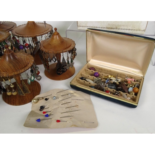 700 - Large selection of assorted costume jewellery including a large selection of earrings on display sta... 