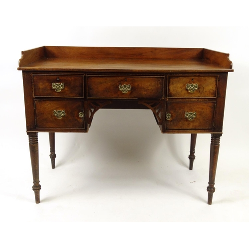 35 - Georgian mahogany writing desk with gallery top and an arrangement of five drawers, 89cm high x 111c... 