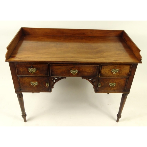 35 - Georgian mahogany writing desk with gallery top and an arrangement of five drawers, 89cm high x 111c... 