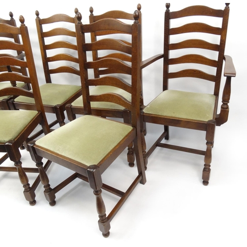 18 - Set of six oak ladderback dining chairs including two carvers, each 102cm high