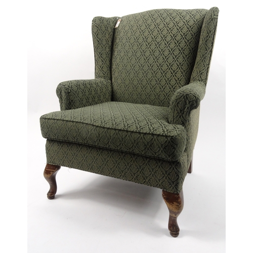 39 - Green floral wingback armchair, 98cm high