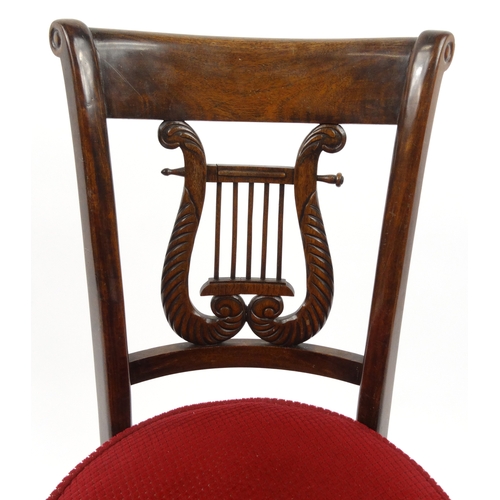16 - Rosewood harpist's stool with lyre shaped back and red upholstered adjustable seat, 86cm high