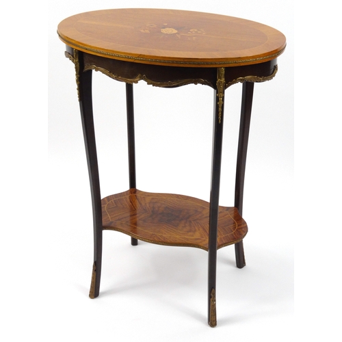25 - Oval walnut occasional table with floral inlaid top and gilt brass mounts, 74cm high