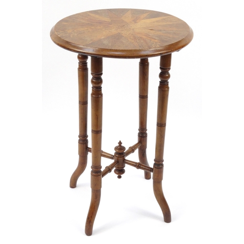 32 - Circular specimen occasional table, the star top inlaid with exotic woods, 66cm high x 44cm diameter