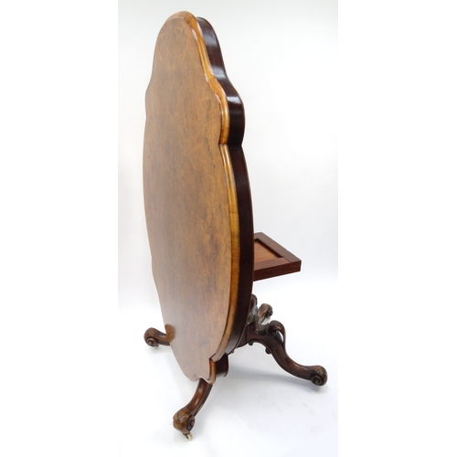 1 - Victorian burr walnut quarter veneered breakfast table with tilting shaped top and carved base, 72cm... 